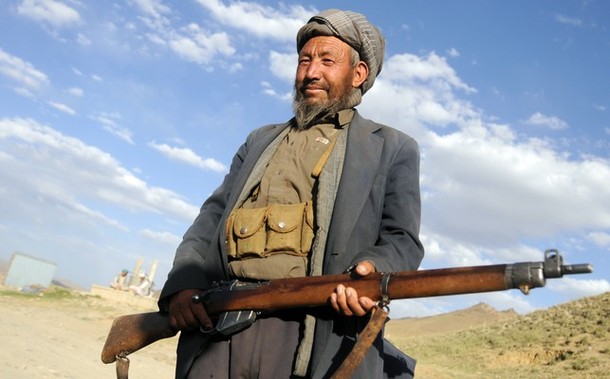 An Afghan shows his old Lee-Enfield rifle that he uses to defend his family against nomads in Behsud district in Wardak province on July 24, 2008. The dispute erupted when Kuchi nomads moved into Wardak province's Behsud area, about 100 kilometres (60 miles) east of Kabul, in recent months in search of grazing for their animals. Hazaras allege that the nomads, who are ethnic Pashtuns, forced their way in and killed several people, and destroyed houses and crops. AFP PHOTO/Massoud Hossaini (Photo credit should read MASSOUD HOSSAINI/AFP/Getty Images)